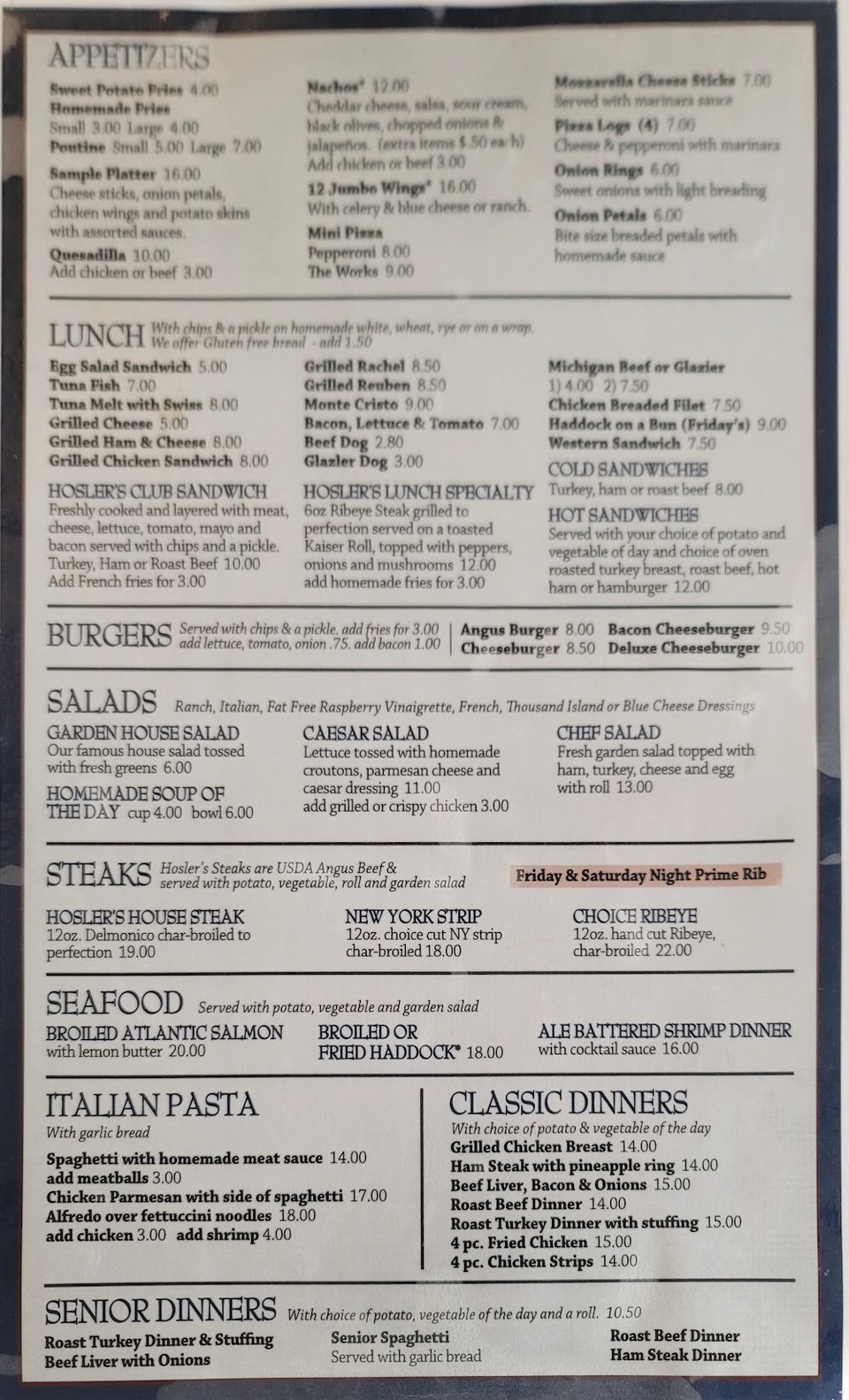 Printed menu with sandwiches and burgers.